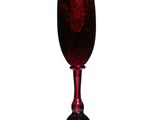 a red wine glass sitting on a white surface