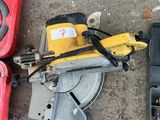 two tools that are laying on the ground next to each other
