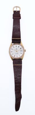 a watch that is sitting on a white surface