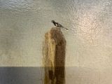 a painting of a bird sitting on top of a wooden post