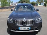 l'avant d'un SUV BMW noir garé sur un parking