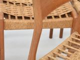 two chairs that are made out of wood and wicker