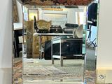 a mirror that is sitting on the floor in the room