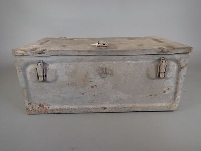 an old metal box that is sitting on a table