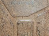 a close up of a gas can with a gas canister in the background