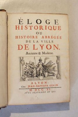 an old book that is open on a table