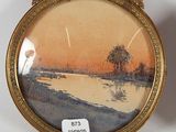 a picture of a picture of a sunset in a gold frame