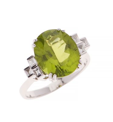 an oval peridot and diamond ring