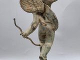 an image of a statue of a cupid holding a bow and arrow