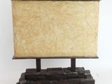 a small television on a wooden stand on a white surface