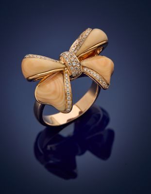 a gold and diamond bow ring