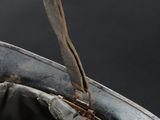 a close up of a baseball glove with a bat sticking out of it
