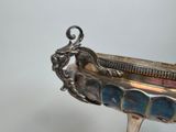a silver plate with a dragon on it