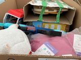 a cardboard box filled with assorted items in a warehouse