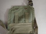 a small bag that has a small tag on it