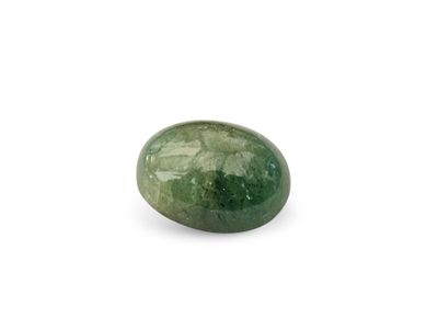 a close up of a green stone on a white surface