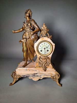 a statue of a woman holding a clock on a table