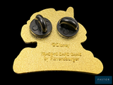 a gold pin with a picture of a dog ' s face on it