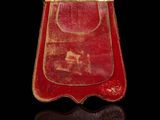 an image of a red purse on a black surface