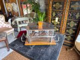a small glass box on a table in a room