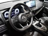 the interior of a car with a steering wheel and dashboard controls