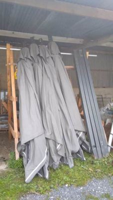 many pieces of metal that are piled up in a shed