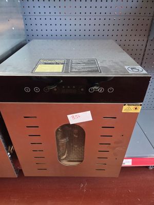 a small oven in the middle of a store shelf