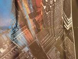 a picture of a tie with a picture of a city on it