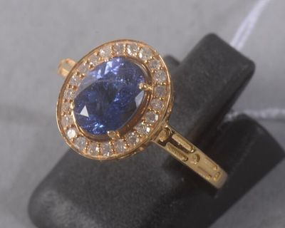 an image of a ring with a blue stone in it