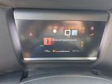 the dashboard of a car with a digital display in the center