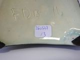 a picture of a vase with a tag on it
