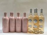 six bouteilles de vin sont alignées sur une surface blanche