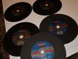 several discs of various sizes and shapes are on a table
