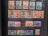 many different types of stamps on a display case