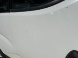 a white van that is parked on the side of the road