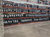 many tires stacked on the shelves in the warehouse