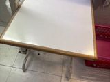 a small table with a towel on top of it