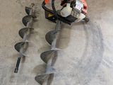 a picture of a man working on a machine in a garage