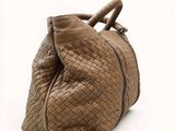 an image of a handbag made out of woven leather