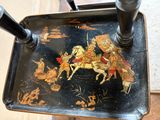 a black tray with a picture of a man riding a horse on it