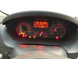 a car dashboard with a digital clock on it