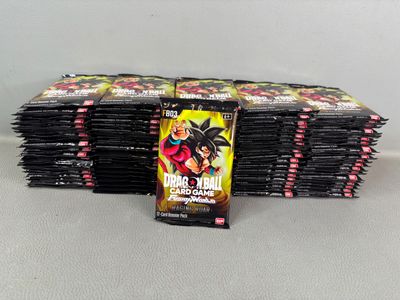 a pile of dragon ball cards sitting on top of each other