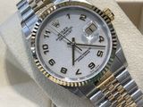 rolex watch with white dial and two tone bracelet on display