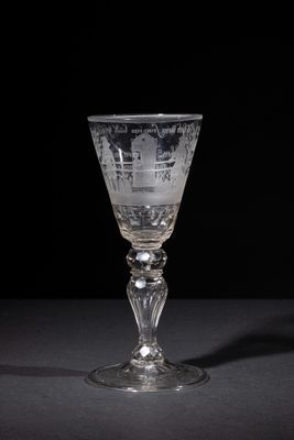 a wine glass that is sitting on a table