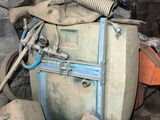 a pile of old luggage and other items in a room
