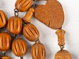 a bunch of wooden beads that are laying on a table