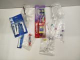 a lot of toothbrushes and toothpaste on the counter