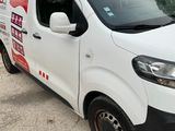 a white van that is parked on the side of the road