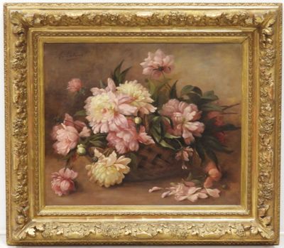 tableau représentant des fleurs roses et blanches, dans un cadre doré, posé sur une table