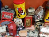 many different types of tins and containers on the table